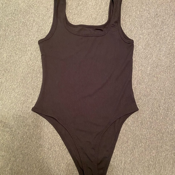 Tops - Black body suit - never been worn